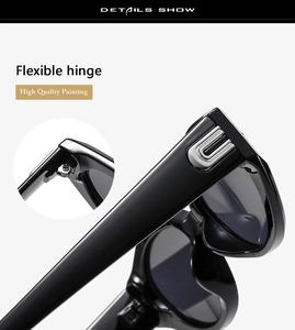 Close-up of black cat-eye sunglasses featuring flexible hinges and silver U-shaped metal detail