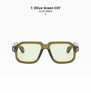Detail view of large square olive green frames with subtle metal rivets and clear lenses