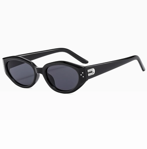 Detailed close-up of retro oval sunglasses with black frame and silver metal accents