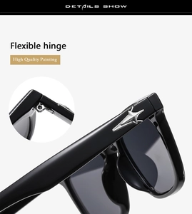 Detail of classic black sunglasses featuring silver star cross hinge and flexible joint