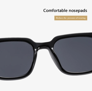 Detail view of the integrated nose pads on black thick frame sunglasses for comfort