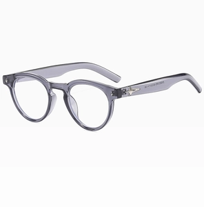 Detail of grey oval glasses frame with star metal hinge and printed size parameters