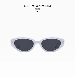 Close-up of white cat-eye sunglasses with silver rivet detail and dark lenses