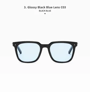 Detail of black square sunglasses with blue lenses and silver star accents on the frame