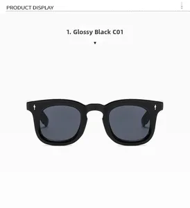 Detailed view of bright black large frame sunglasses with silver arrow metal ornaments