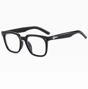 Detail of black rectangular eyeglasses with silver star hardware on the frame arm