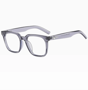 Detail view of transparent grey square frame glasses with silver star metal hinge accent