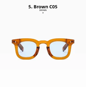 Detail view of retro brown square sunglasses with light blue lenses and arrow rivets
