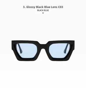 Detail of square sunglasses featuring thick black frames and translucent blue lenses