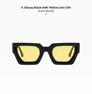 Detail of chunky black square sunglasses featuring transparent yellow lenses and bold wide temples