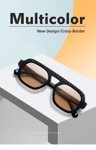 Detail of square sunglasses featuring black wave textured frames and gradient brown lenses