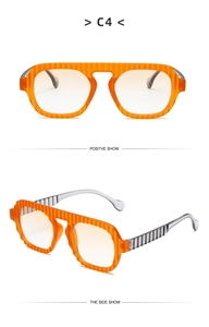 Detailed macro view showing orange textured frame and gray gradient temples of sunglasses