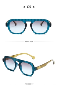 Detail view of blue textured frames and amber temples on oversized sunglasses C5