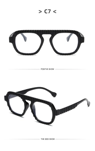 Front and side view of black textured frame sunglasses with vertical ripple pattern