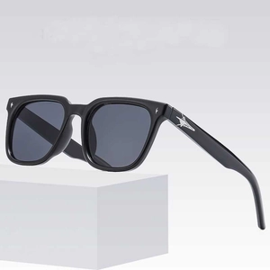 Classic square black sunglasses with star decoration on geometric display stand