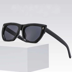 Fashionable black square sunglasses with metallic rivets on a minimalist white stand