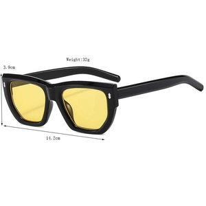 Retro oversized cat-eye sunglasses with thick black frame and yellow lenses