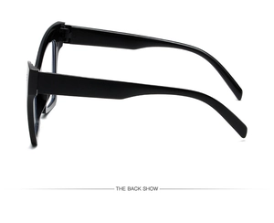 Detailed back view of glossy black oversized frames showing wide temples and sleek finish