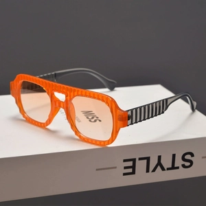 Oversized orange sunglasses with vertical water ripple texture and stylish black temples