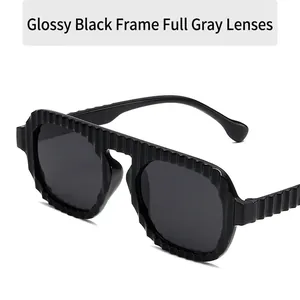 Glossy black oversized square sunglasses with wavy ribbed texture and grey lenses