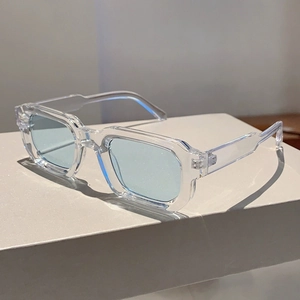 Square ice blue transparent sunglasses in minimalist plastic frames from a 45-degree angle