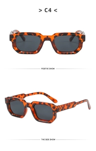 Detailed front and side view of tortoise shell square frame sunglasses with grey lenses