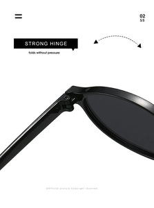 Macro detail of strong metal hinge on oval sunglasses showing flexible folding mechanism