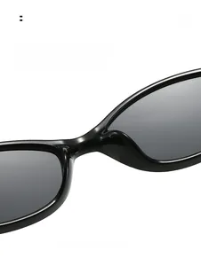 Detail of ergonomic integrated nose pads on black oval cat eye sunglasses for comfort
