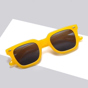 Modern square yellow sunglasses with dark polarized lenses and silver arrow accents