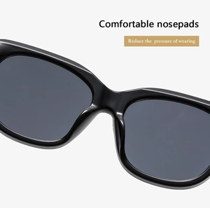 Detail view of smooth integrated nose pads on black square frame sunglasses for comfort