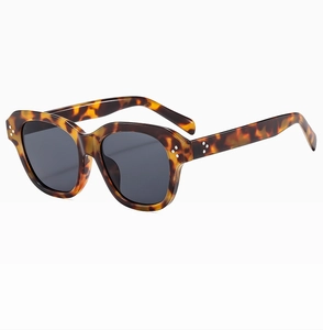 Retro oversized tortoiseshell sunglasses with silver rivet accents and dark grey lenses