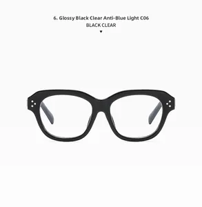 Close-up of shiny black square frame glasses with metal rivets and anti-blue light lenses