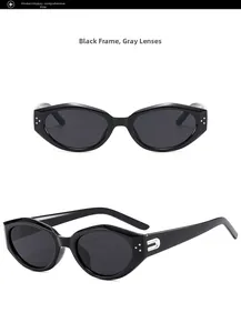 Detail view of black vintage cat-eye sunglasses with silver U-shaped metal decorations