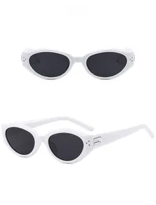 Detail view of white cat-eye sunglasses featuring gray lenses and silver metal hinges