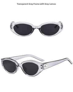 Detail of vintage cat-eye sunglasses in transparent gray with silver metal hollow decor