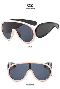 Front and side views of trendy oversized pink shield sunglasses with dark lenses