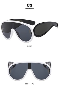 Detailed side and front views of white oversized futuristic shield sunglasses with grey lenses