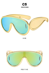 Y2K futuristic oversized gold shield sunglasses with green-blue gradient lenses