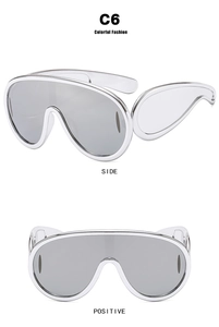 Macro detail of silver oversized shield sunglasses with reflective lenses and sleek C6 frame