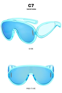 Close-up of oversized translucent blue mirrored sunglasses showing front and side views