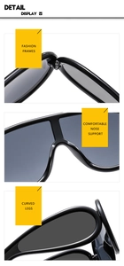 Close-up of oversize sunglasses featuring smooth black frames and durable metal hinges