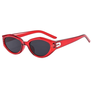 Retro red cat-eye sunglasses with dark lenses and silver hinge detail, 45-degree angle view