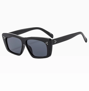 Detail of classic black square sunglasses featuring polished frame and silver triple studs