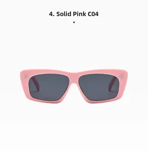 Detail of pink rectangular sunglasses with silver triple-dot rivets and grey lenses