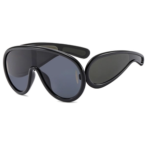 Futuristic black oversized shield sunglasses with thick temples and sleek tinted lenses