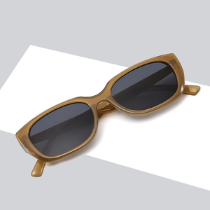 Retro rectangle cat eye sunglasses with amber translucent frames and dark lenses