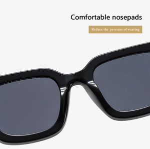 Detail of square oversized sunglasses showing comfortable wide nose pads and black frame