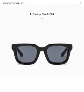 Detail view of glossy black square frame sunglasses with dark grey lenses and metal trim