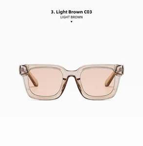 Detail view of light brown square sunglasses with transparent oversized frames and lenses