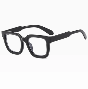 Detail shot of black square frame sunglasses with high-gloss finish and clear lenses